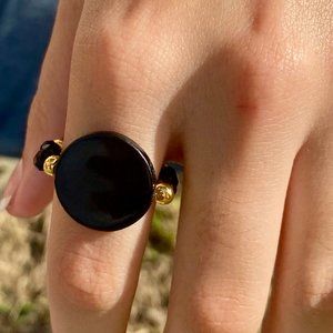 Black and gold ring